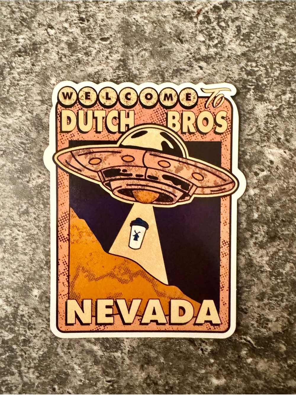 Dutch Bros Sticker — Orange, Black, Cream UFO Nevada